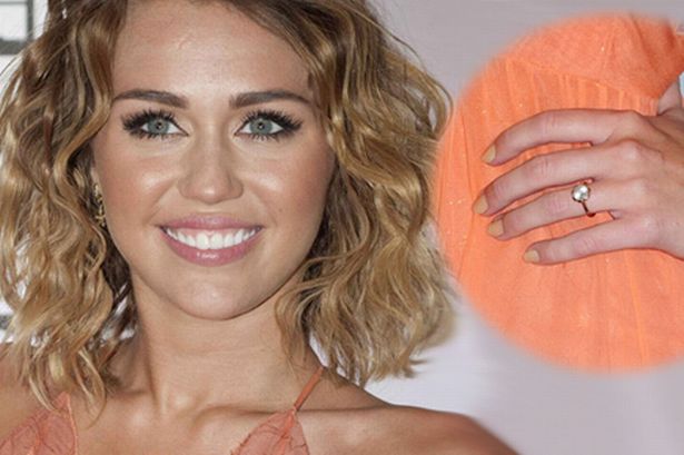 Miley has a massive ring on her engagement finger she would like you all to 